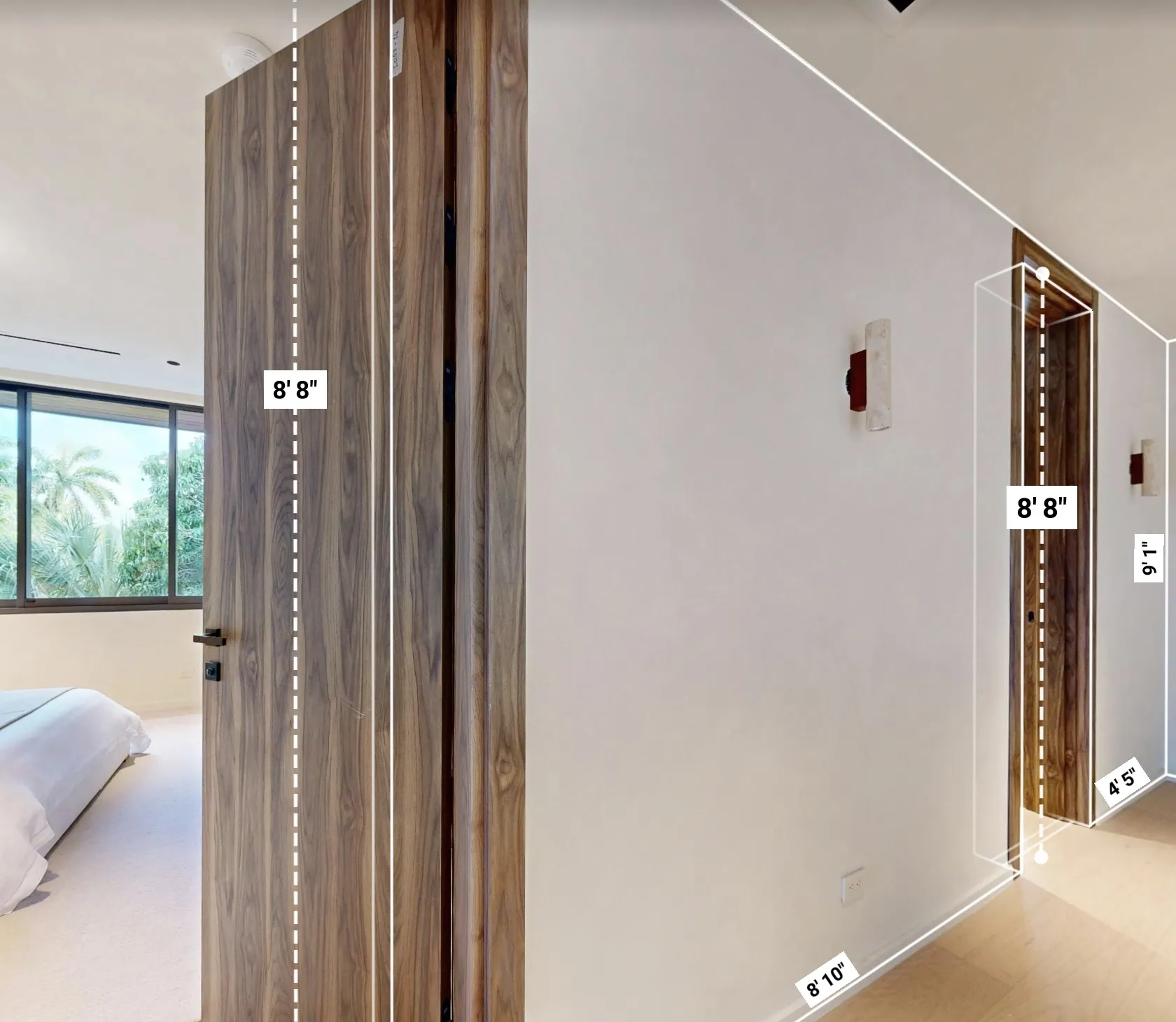 Mansion hallway with door heights and wall lengths measured in feet and inches